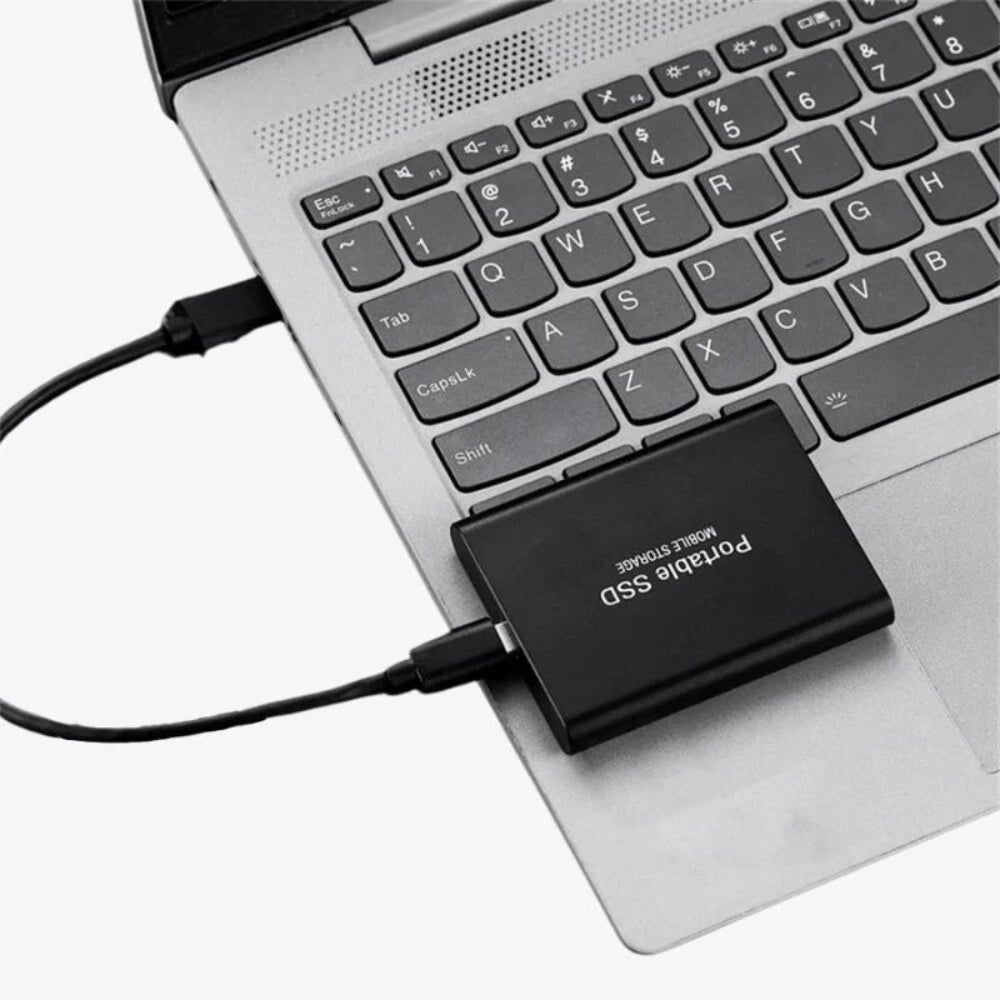 Portable external SSD featuring a sleek metal design, USB 3.1 connectivity for fast data transfer, and available in multiple storage capacities. 0